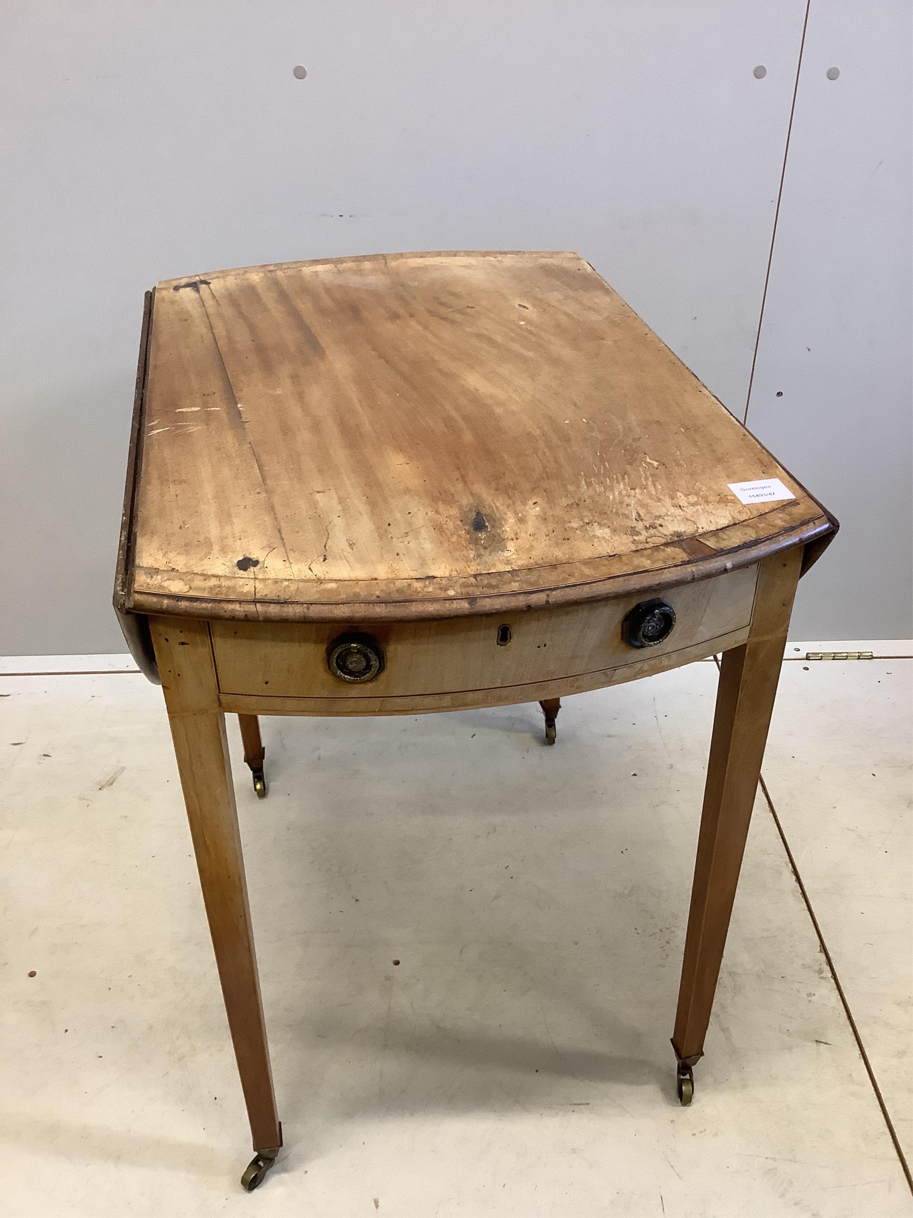 A George III banded mahogany oval topped Pembroke table, width 51cm, depth 76cm, height 73cm. Condition - poor